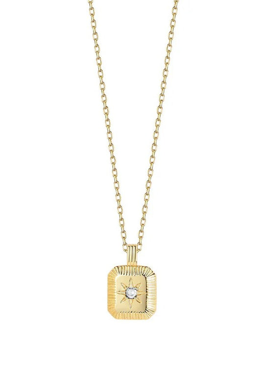 Gold necklace with a square pendant featuring a gemstone on a white background