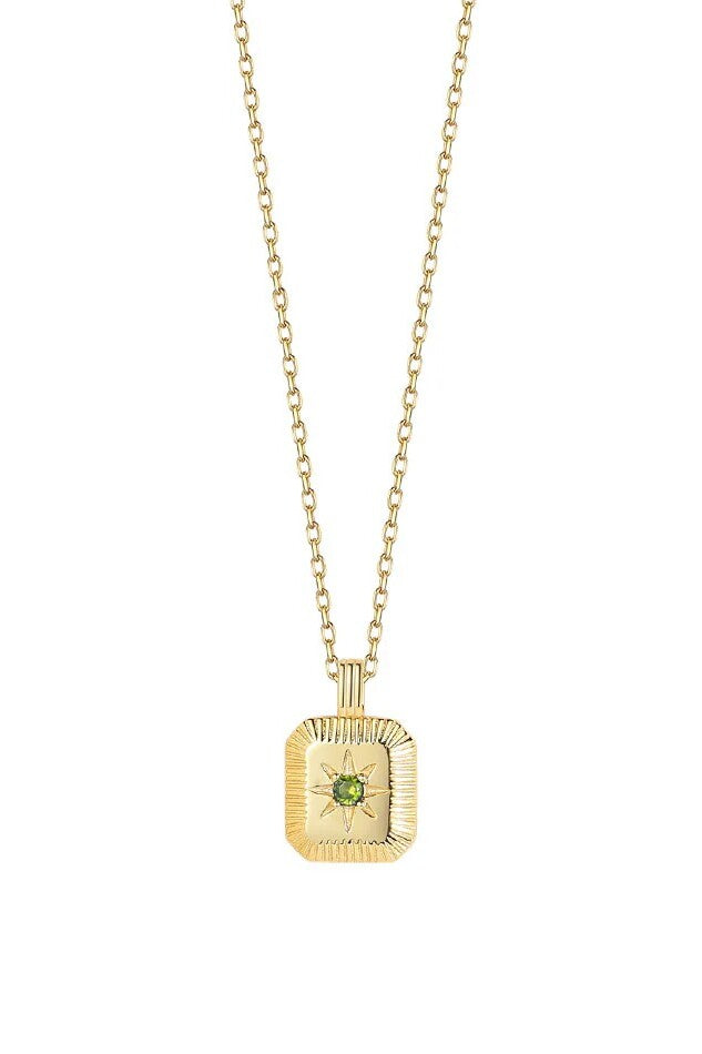 Gold necklace with a rectangular pendant featuring a green gemstone on a white background