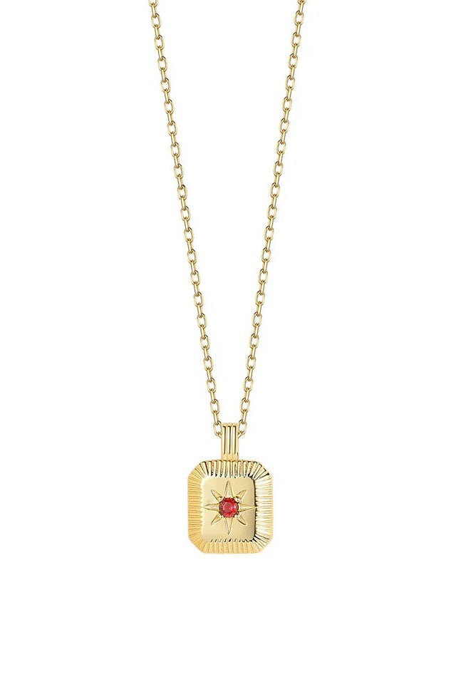 Gold necklace with a square pendant featuring a red gemstone on a white background