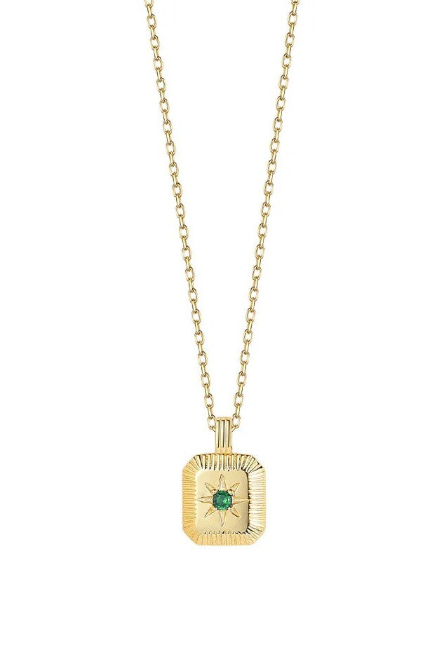 Gold necklace with a square pendant featuring a green gemstone on a white background