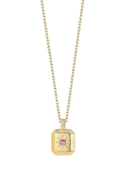Gold necklace with a square pendant featuring a pink gemstone on a white background