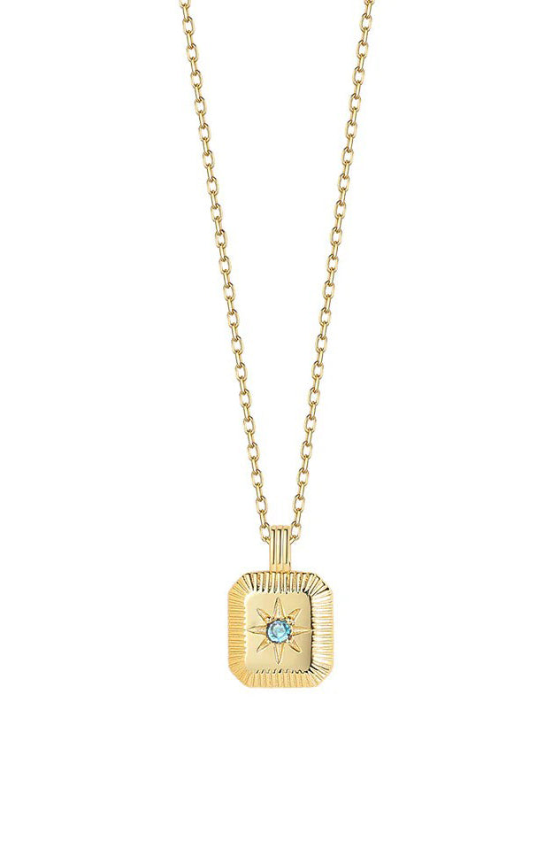 Gold necklace with a square pendant featuring a blue gemstone on a white background
