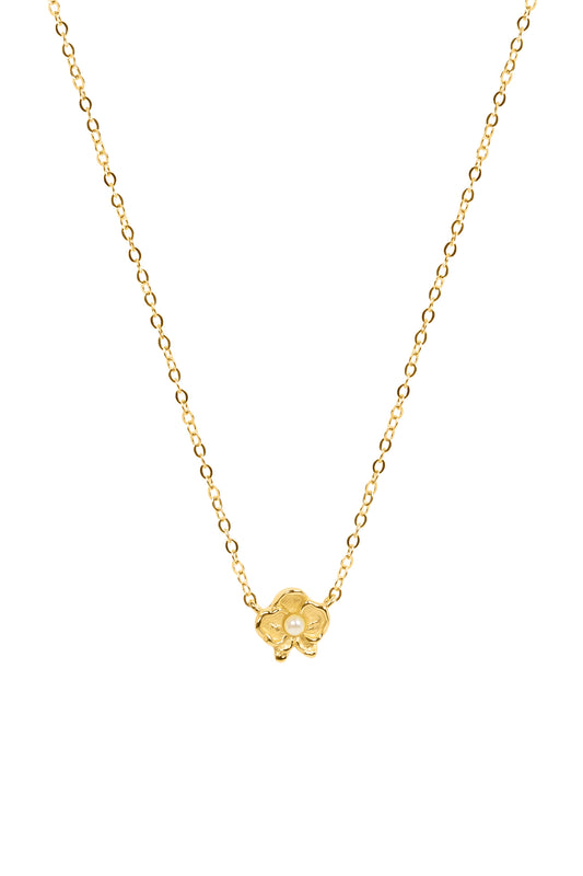 Gold necklace with a floral pendant featuring a pearl on a white background