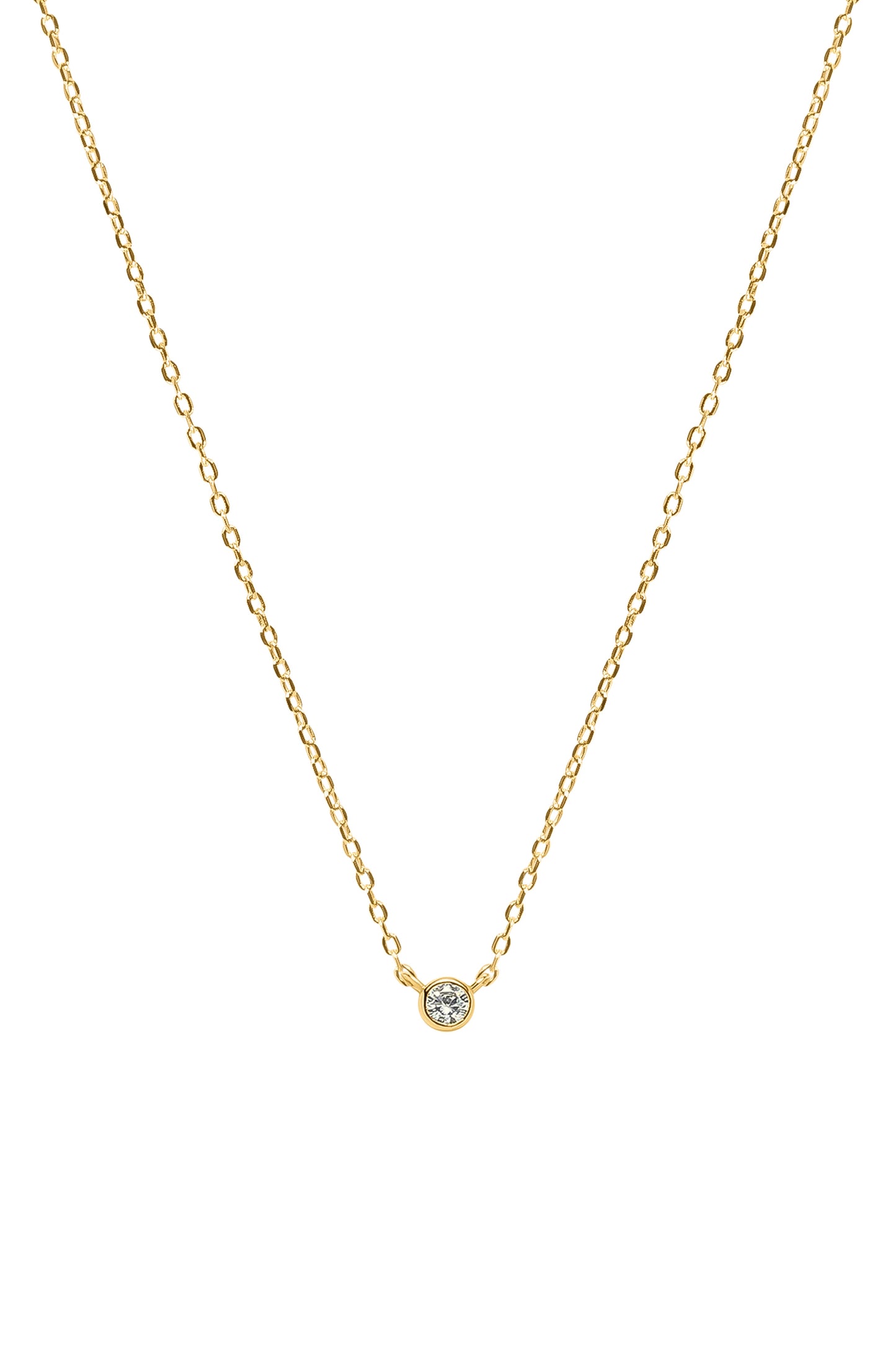 Gold necklace with a small round gemstone pendant on a white background