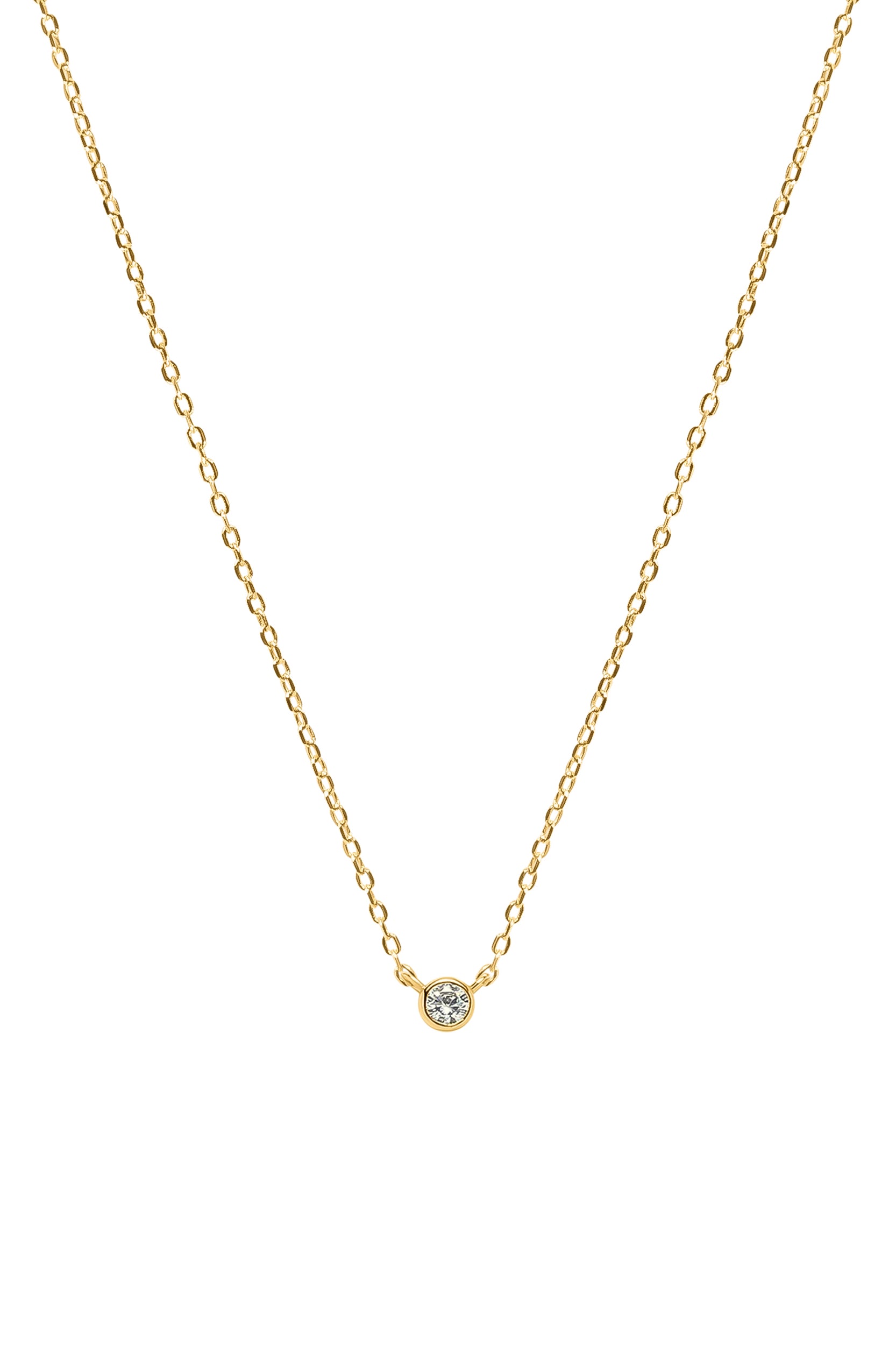 Gold necklace with a small round gemstone pendant on a white background