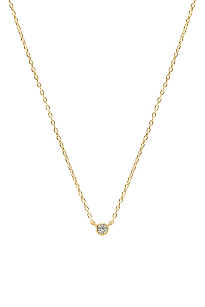 Gold necklace with a small round gemstone pendant on a white background