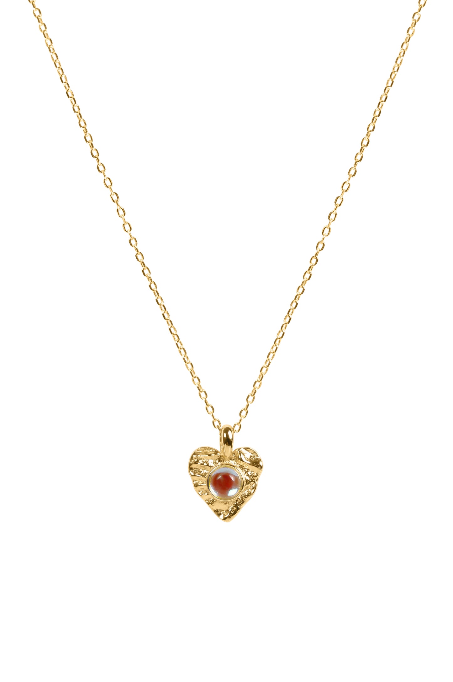 Gold necklace with a heart-shaped pendant featuring a moonstone on a white background