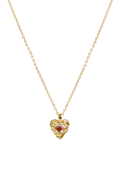 Gold necklace with a heart-shaped pendant featuring a moonstone on a white background
